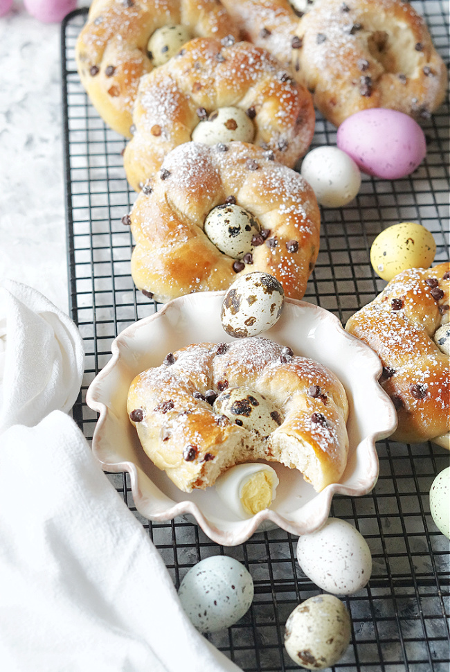 Easter Bread Wreaths with Quail Eggs are the diminutive relatives of Greek or Italian Easter Bread, and because they're made using the Tangzhong method, they're wonderfully fluffy and soft, even the next day! #easter #easterbread #wreathbread #italianeasterbread #eggs #quaileggs #chocolate #chocolatechips #tangzhong #tangzhongbread #vanilla #fiestafriday